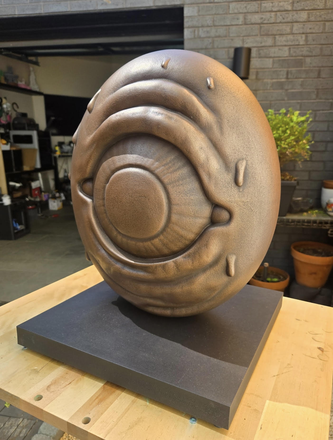 Sculptures — bronze O sculpture on black base